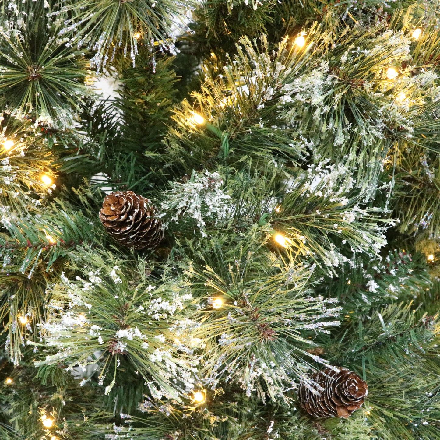 7' Brilste Mixed  Hinged Tree with Snow and Glitter and 78 Frosted Pine Cones and 650 Clear LED Lights